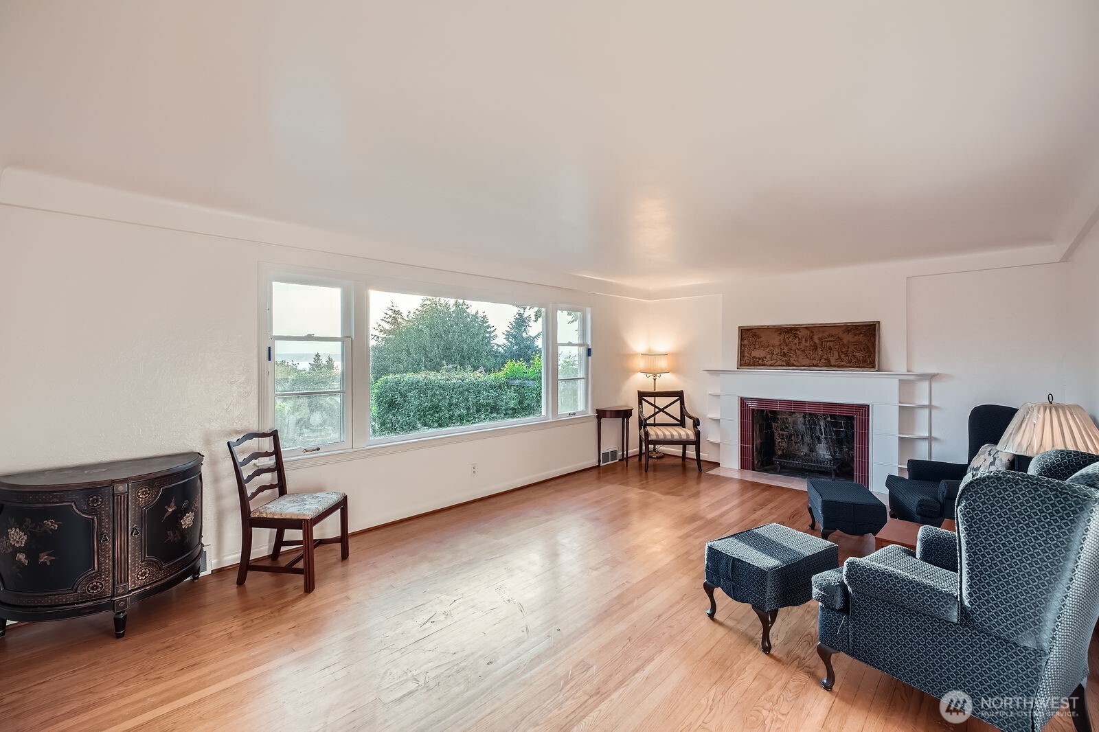 3041 52nd Avenue Southwest Seattle, WA 98116 - Photo 5 of 31 a living room with furniture and a fireplace