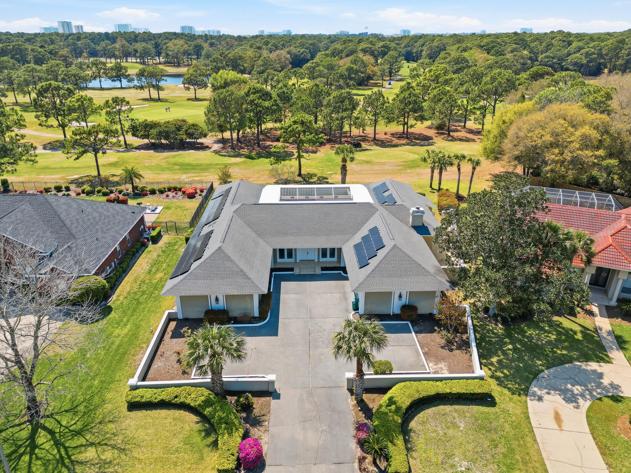an aerial view of residential houses with outdoor space and swimming pool