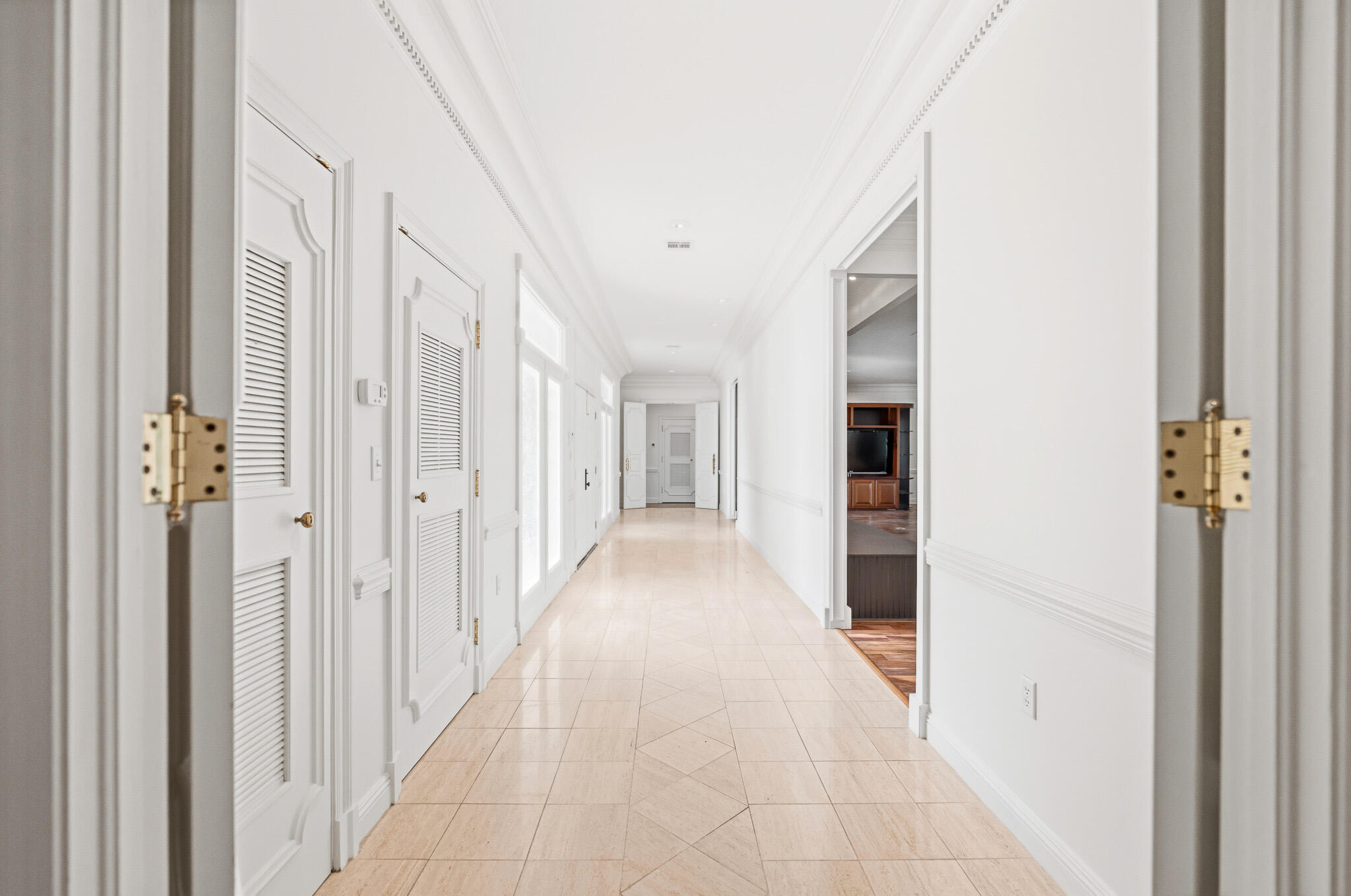 8 Weekewachee Circle Destin, FL 32541 - Photo 14 of 55 a view of a hallway with wooden shelves