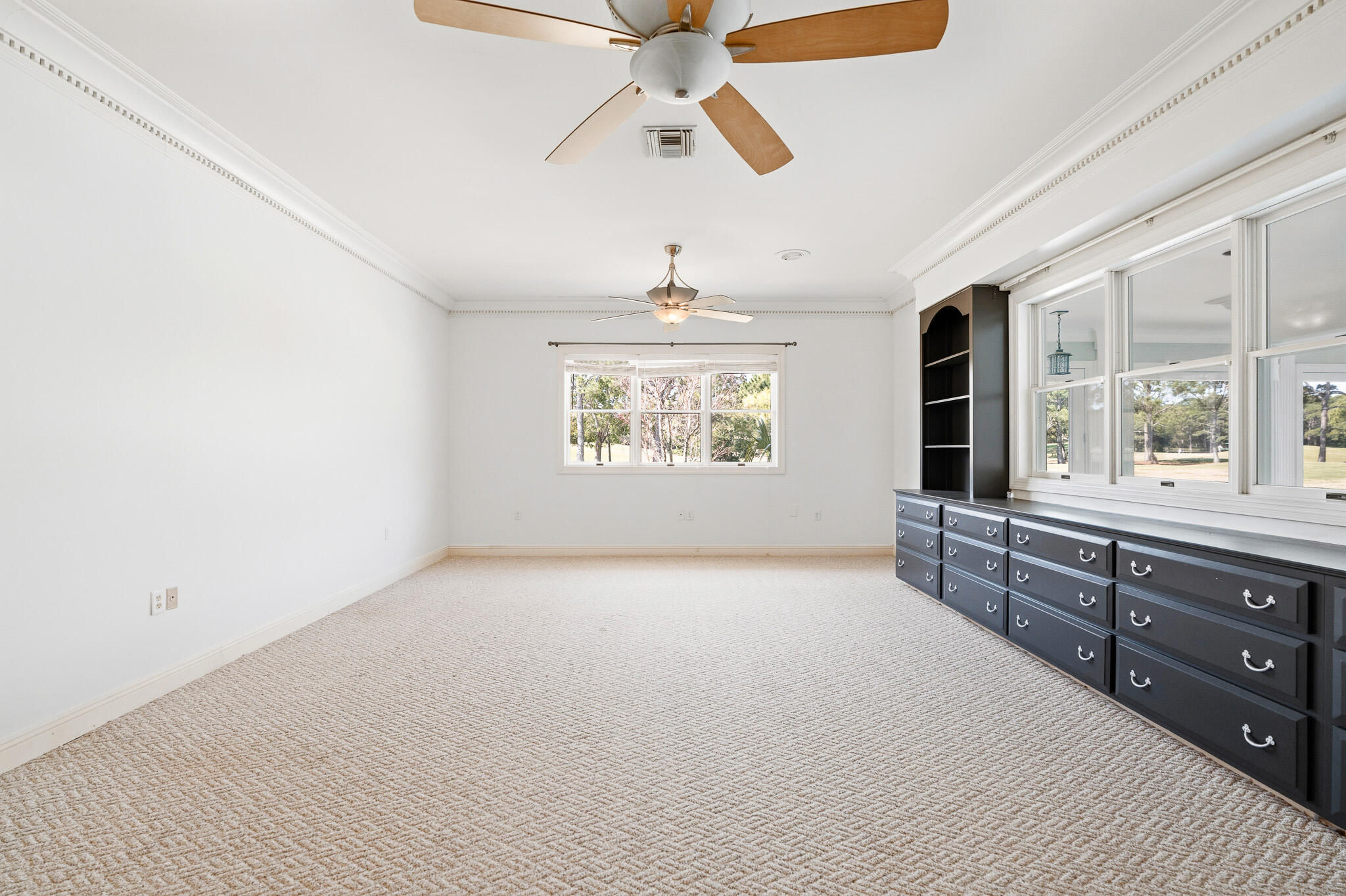 8 Weekewachee Circle Destin, FL 32541 - Photo 27 of 55 an empty room with windows and fan
