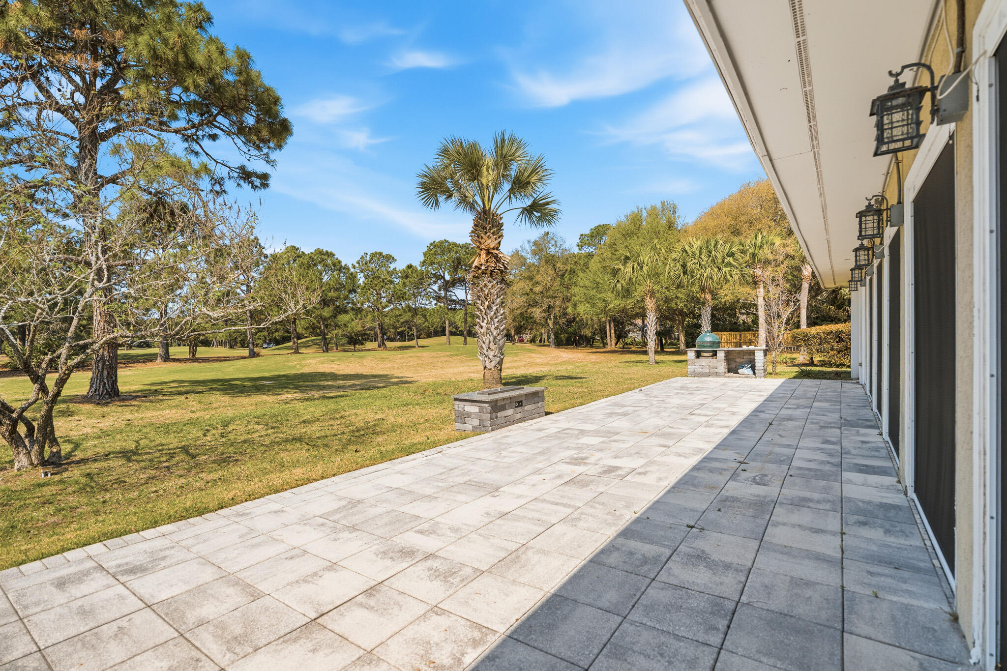 8 Weekewachee Circle Destin, FL 32541 - Photo 48 of 55 a view of swimming pool with seating space and trees in the background
