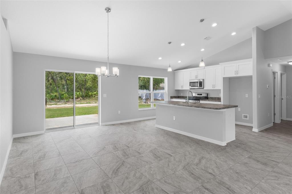 16375 Kakawi Road Brooksville, FL 34614 - Photo 8 of 30 a view of a kitchen with a sink and a window