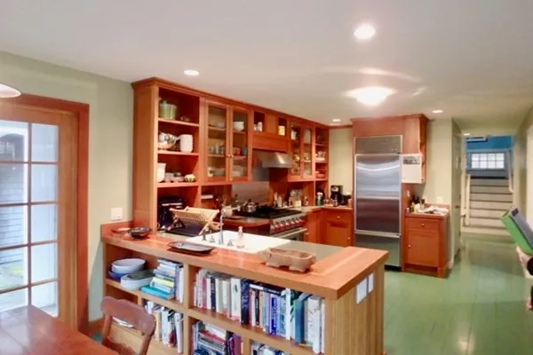 a large kitchen with a table and chairs in it