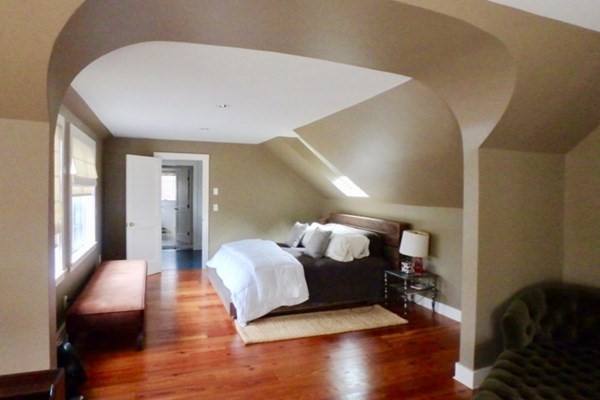 56 Chilmark Road Chilmark, MA 02535 - Photo 5 of 8 a spacious bedroom with a bed and wooden floor