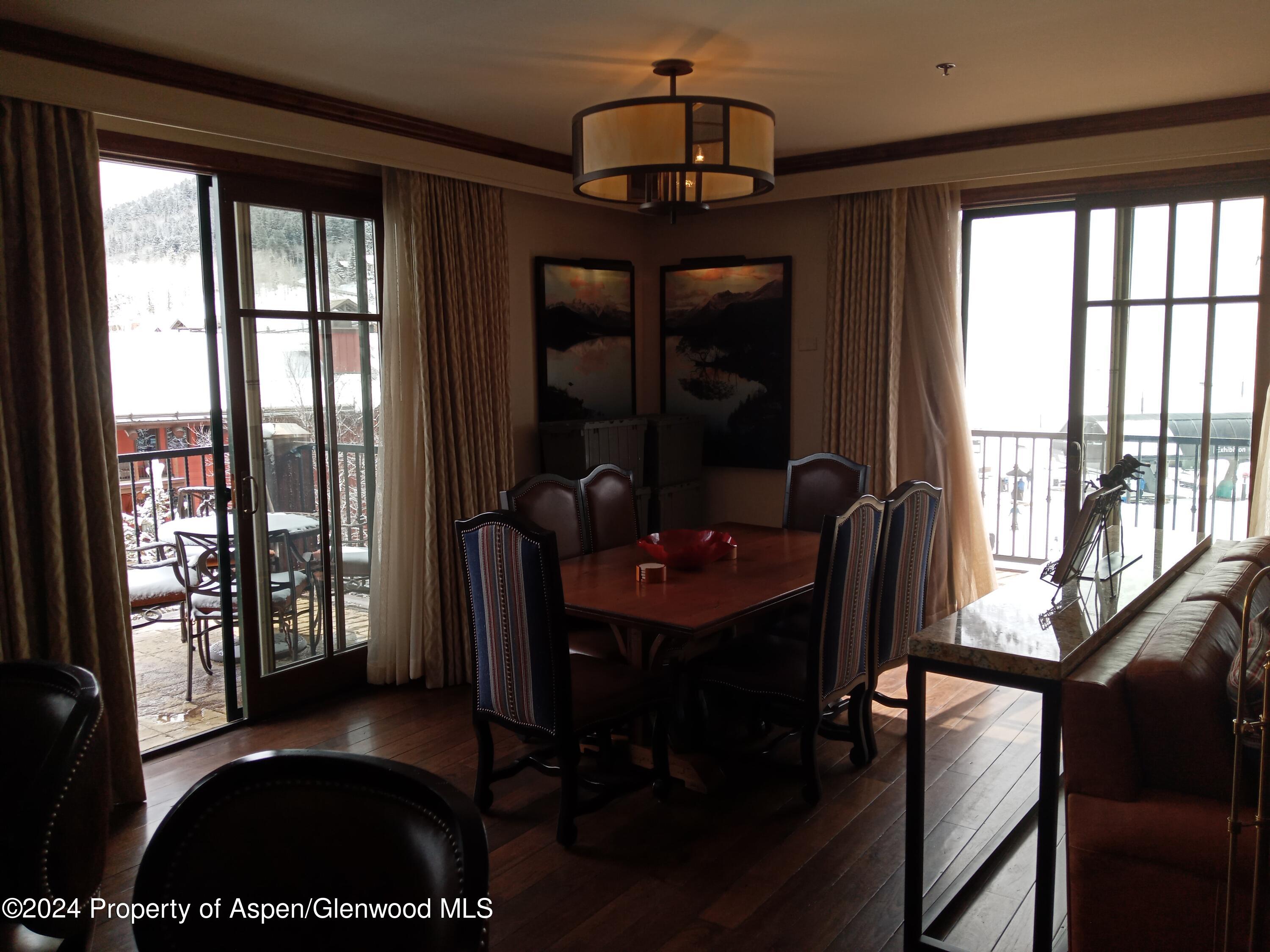 75 Prospector Road, Unit 841012 Aspen, CO 81611 - Photo 40 of 43 a view of a livingroom with furniture window and outside view