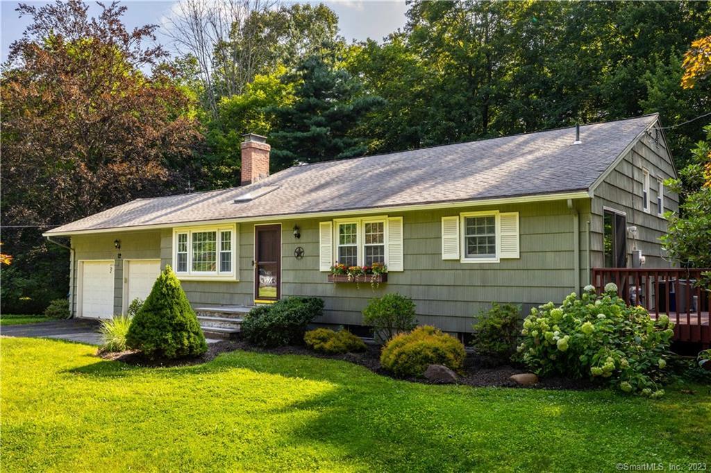 12 Valley View Drive Simsbury, CT 06089 - Photo 1 of 1 a front view of a house with a yard and outdoor seating