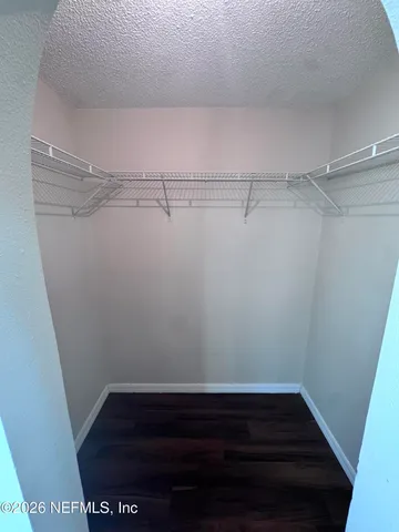 a view of a room with racks on the wall