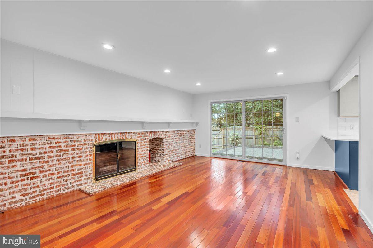 114 Partree Road Cherry Hill, NJ 08003 - Photo 13 of 44 a view of empty room with wooden floor and fireplace