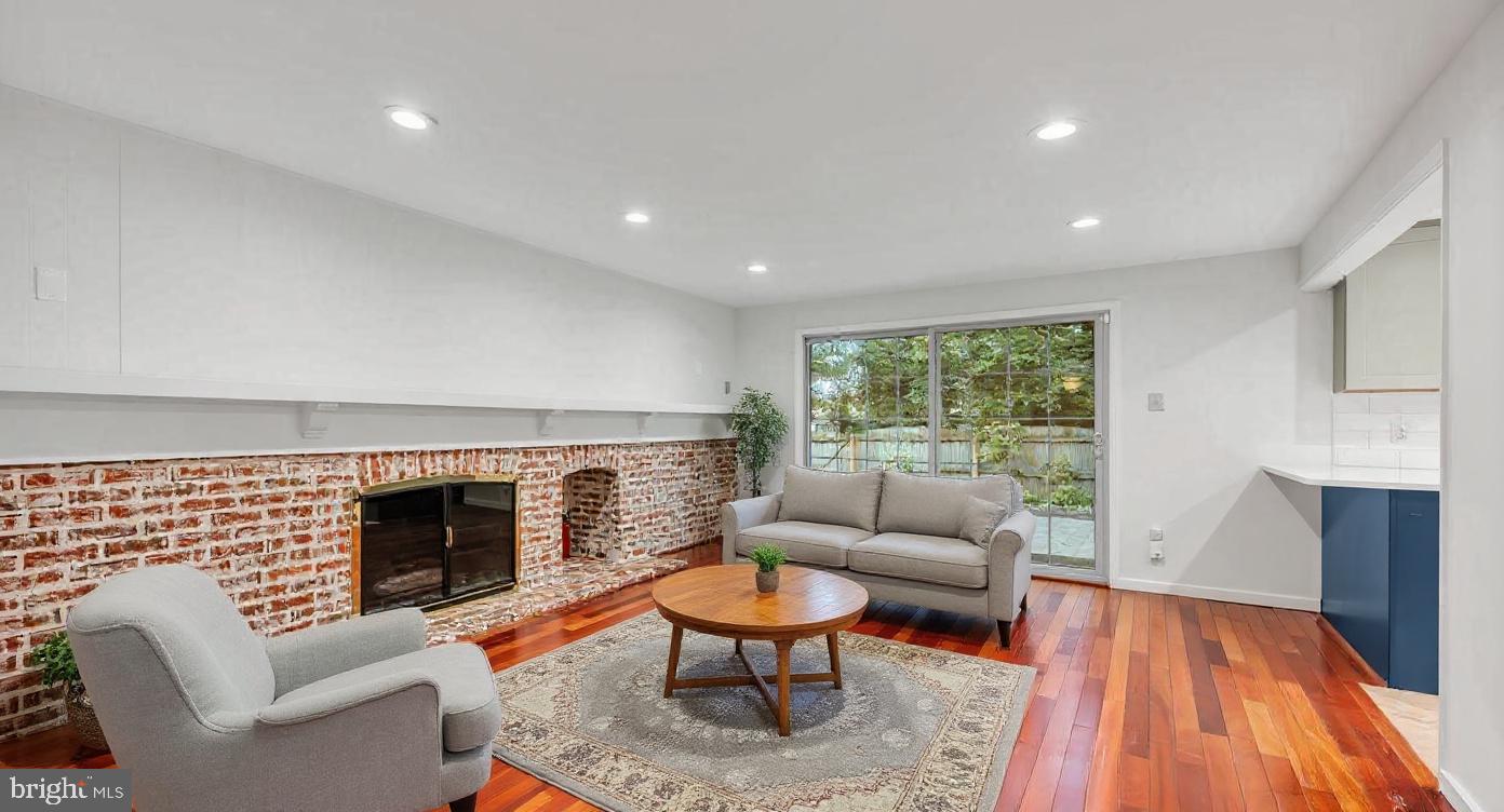 114 Partree Road Cherry Hill, NJ 08003 - Photo 14 of 44 a living room with furniture a rug and a fireplace