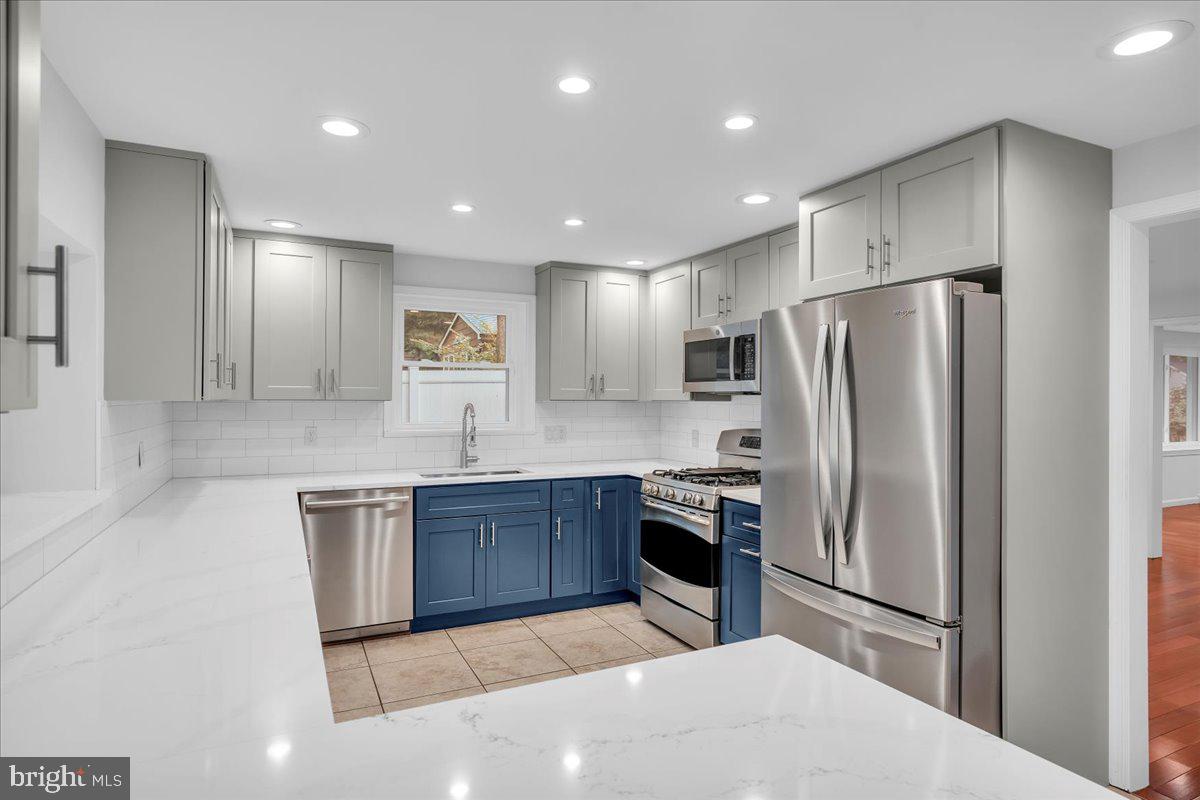 114 Partree Road Cherry Hill, NJ 08003 - Photo 15 of 44 a kitchen with stainless steel appliances granite countertop a refrigerator sink and stove