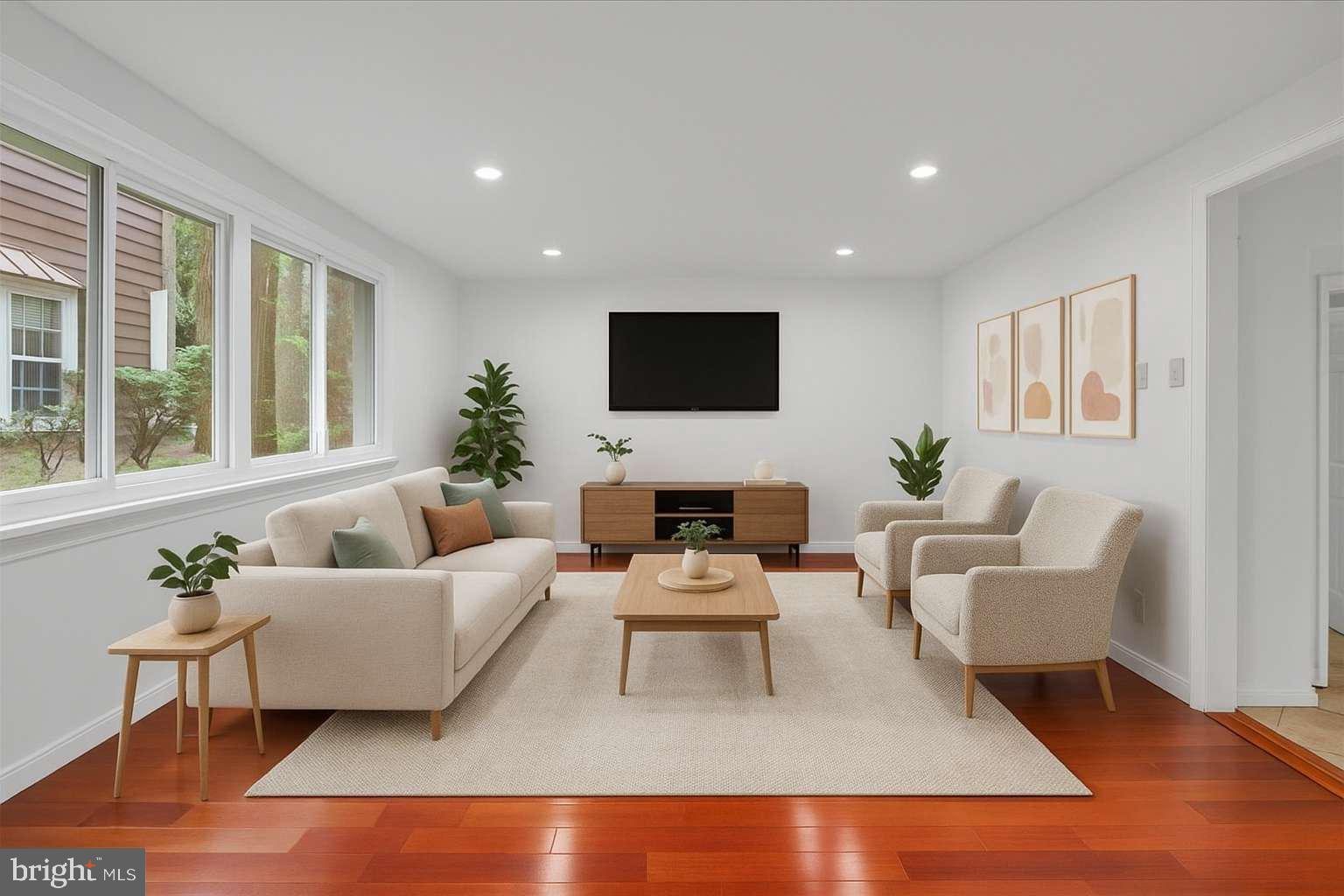 114 Partree Road Cherry Hill, NJ 08003 - Photo 10 of 44 a living room with furniture a flat screen tv and a large window