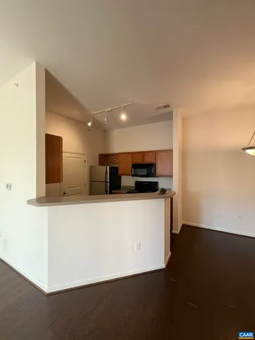 a view of kitchen with stainless steel appliances a refrigerator and a stove