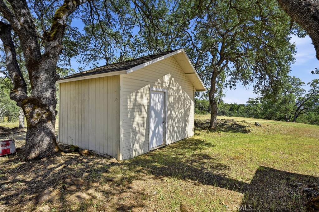 16965 Spruce Grove Road Hidden Valley Lake, CA 95467 - Photo 23 of 34 a view of a backyard with large trees