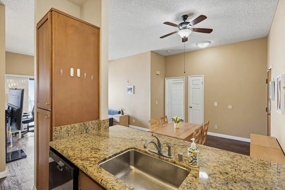 8324 Regents Road, Unit 2E San Diego, CA 92122 - Photo 12 of 31 a dining hall with a sink and breakfast area