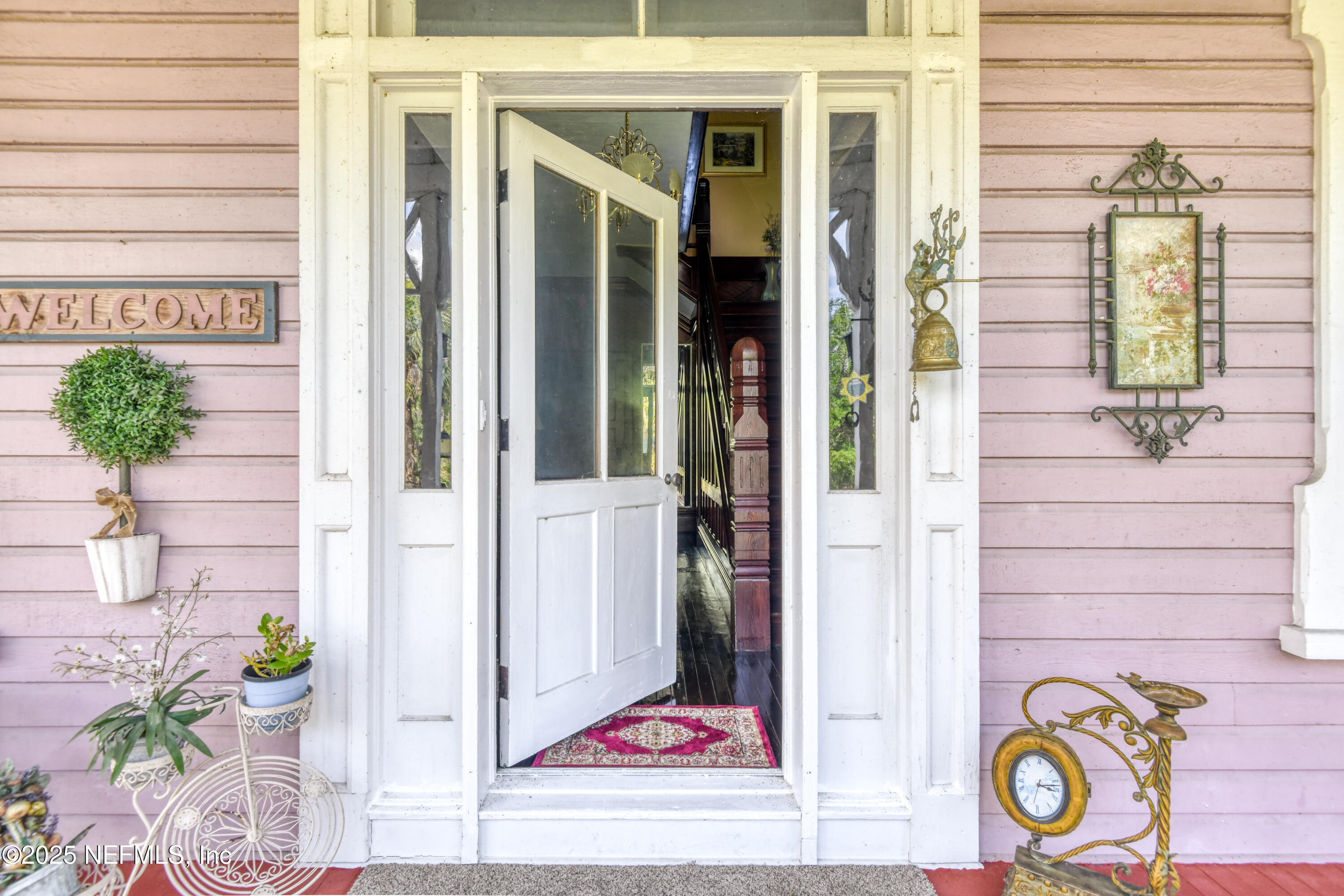 240 Sisco Road Pomona Park, FL 32181 - Photo 12 of 43 a view of a door of the house with potted plants