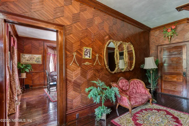 a view of an entryway with wooden floor