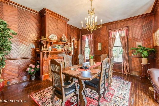 a bedroom with a bed dresser and a flat tv screen