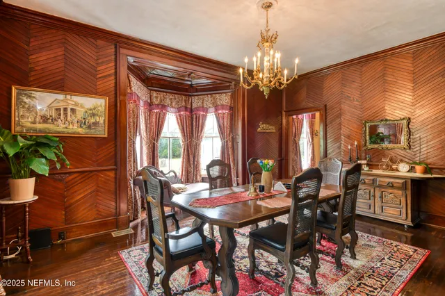 a bedroom with a bed and large window