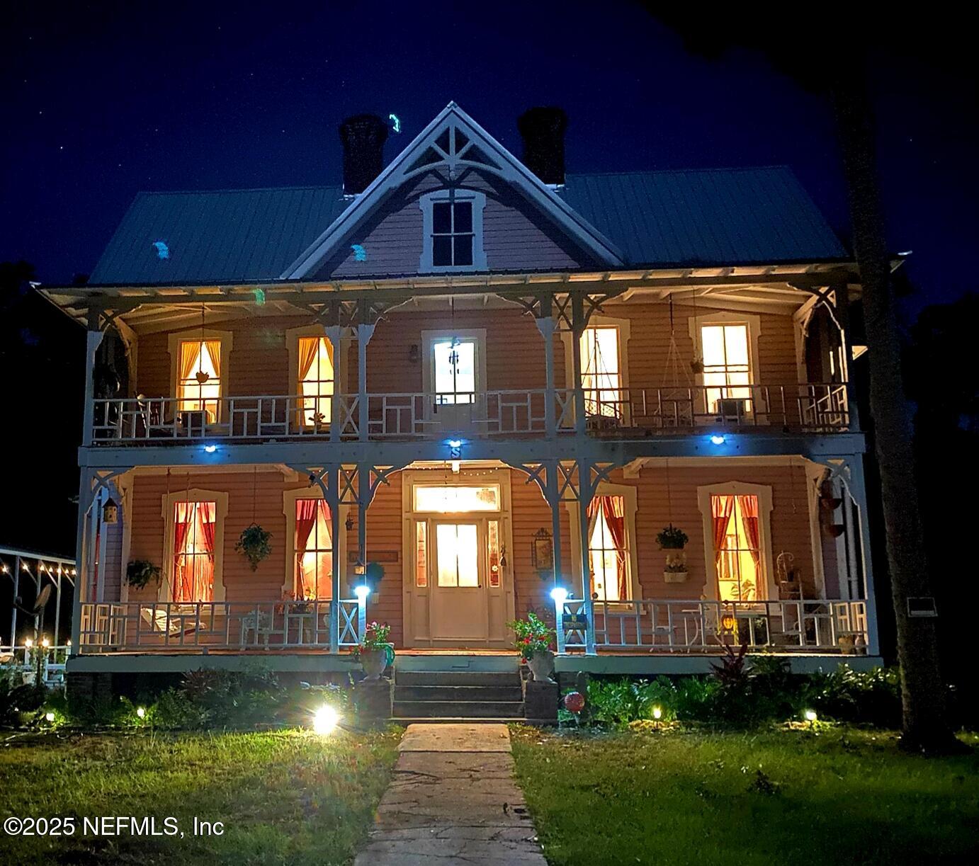 240 Sisco Road Pomona Park, FL 32181 - Photo 2 of 43 a front view of a house with lots of green space