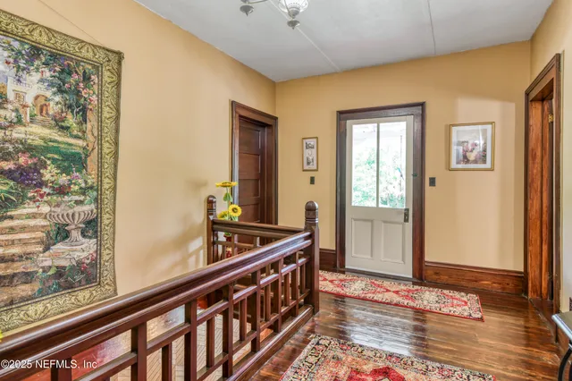 a view of a lush green forest with lots of trees
