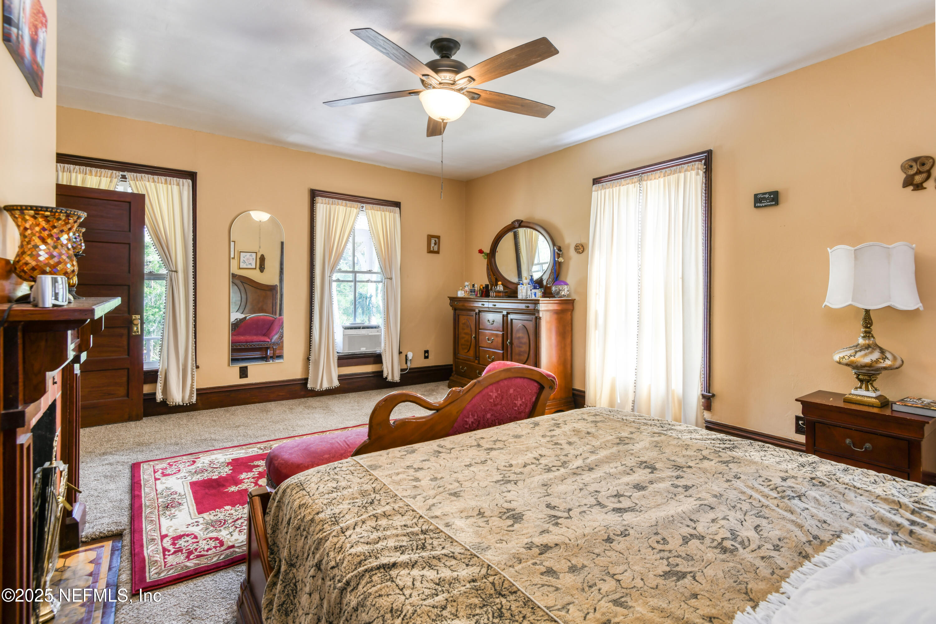 240 Sisco Road Pomona Park, FL 32181 - Photo 26 of 43 a bedroom with a bed dresser and a flat tv screen