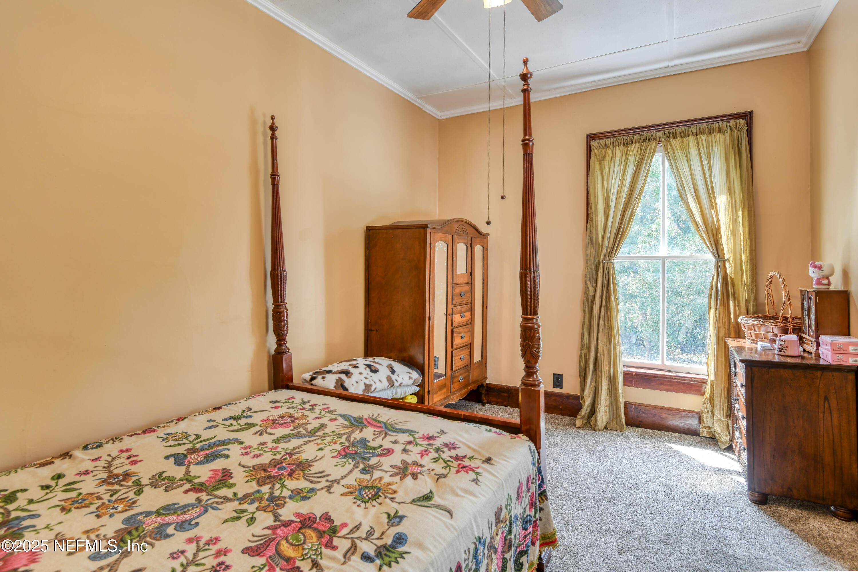 240 Sisco Road Pomona Park, FL 32181 - Photo 30 of 43 a bedroom with a bed and large window