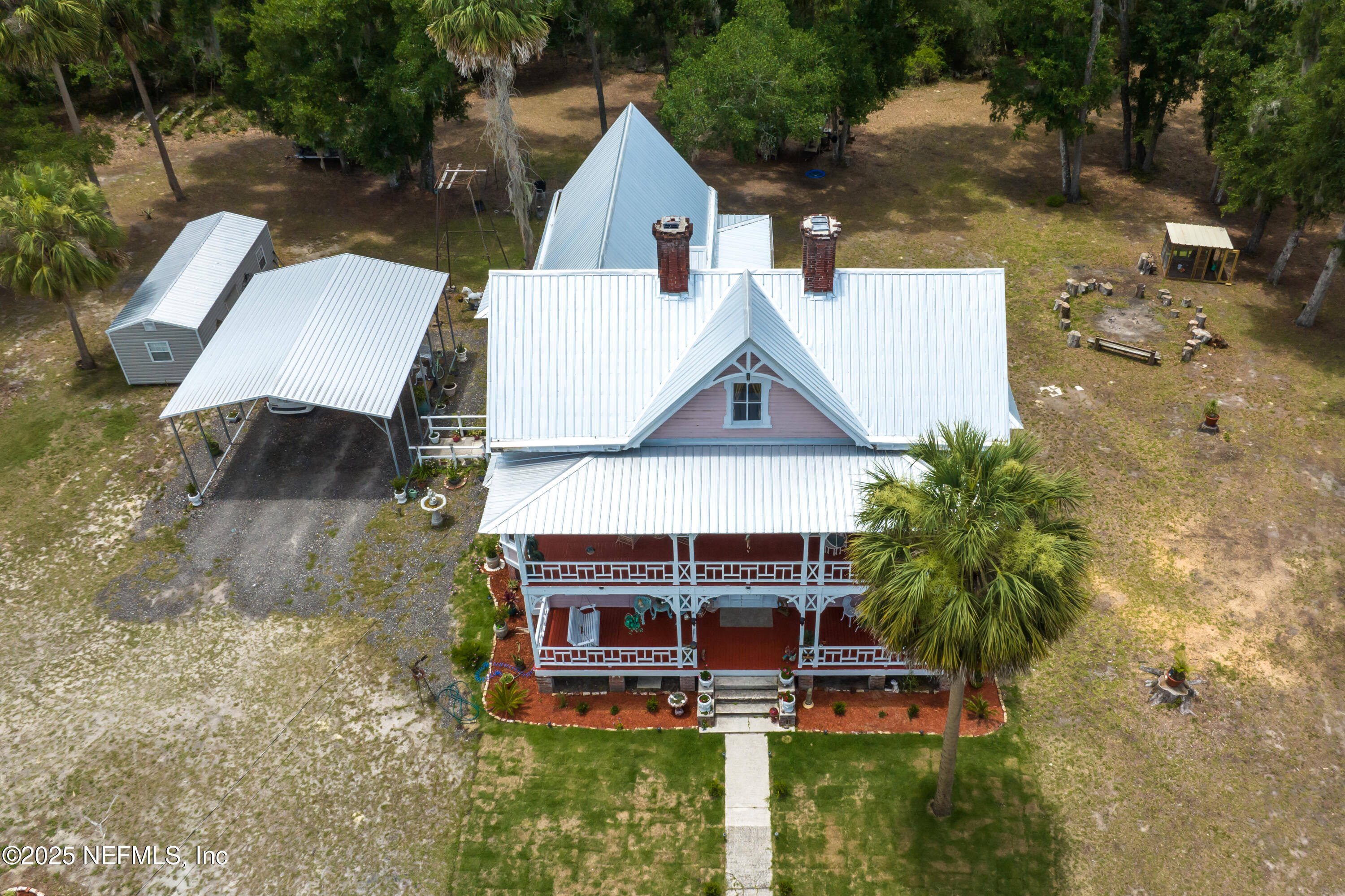 240 Sisco Road Pomona Park, FL 32181 - Photo 38 of 43 an aerial view of a house with swimming pool and porch with furniture