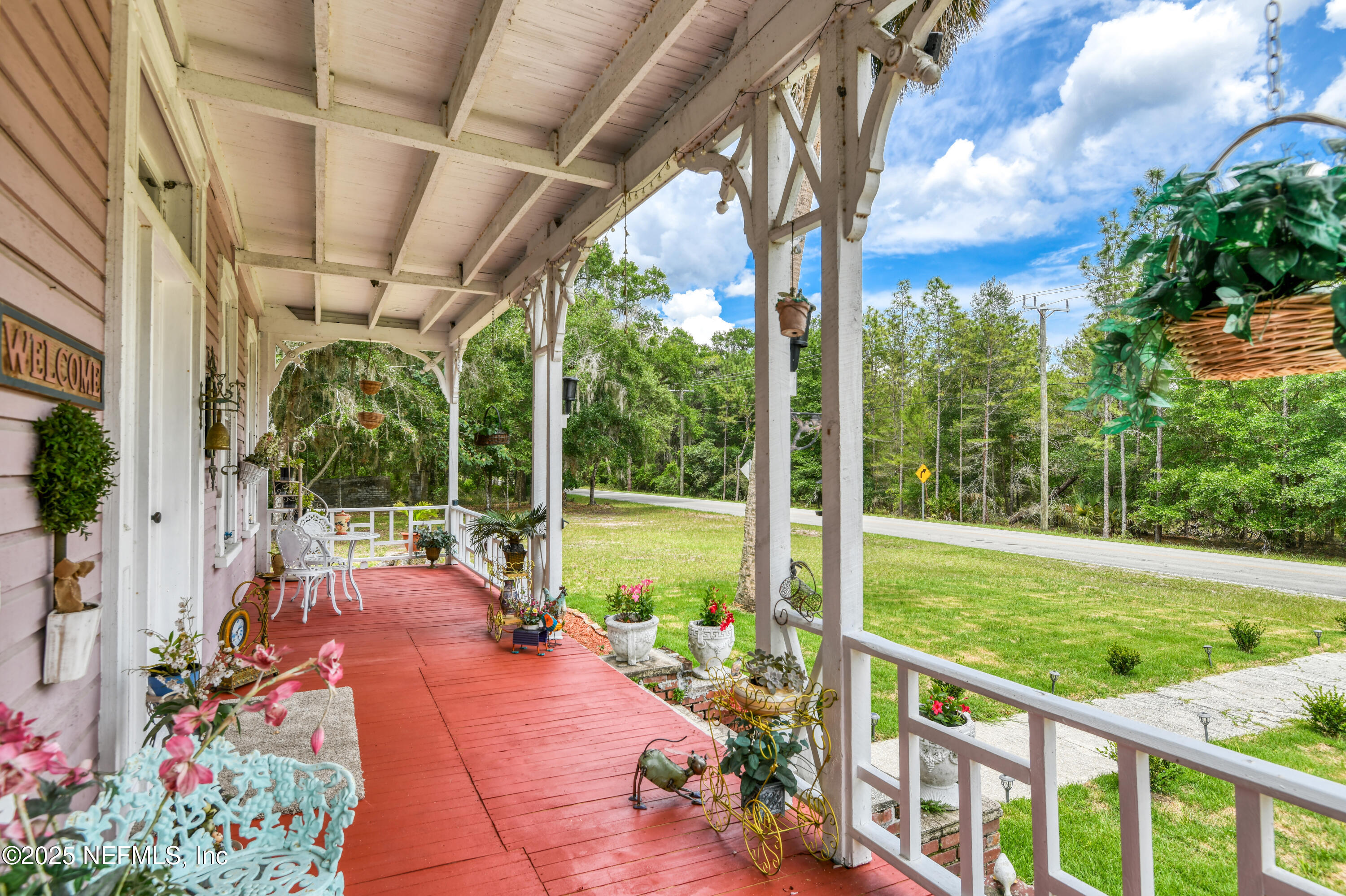 240 Sisco Road Pomona Park, FL 32181 - Photo 9 of 43 a view of a porch with garden