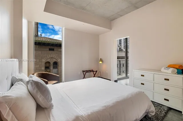 a bedroom with a bed and a closet