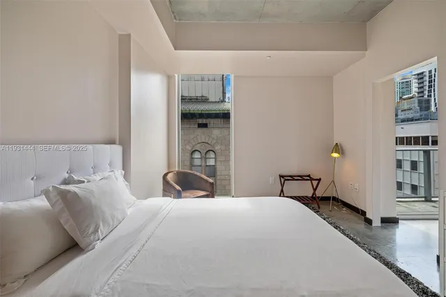 a bedroom with a bed and a cabinets