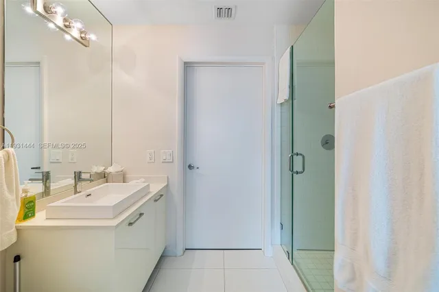 a bathroom with a sink and mirror