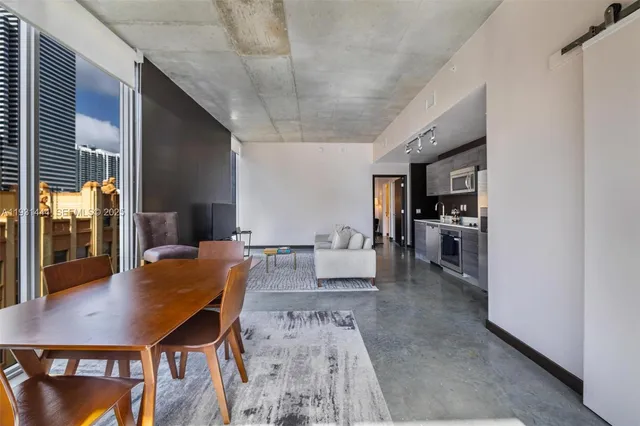 a living room with furniture and a table