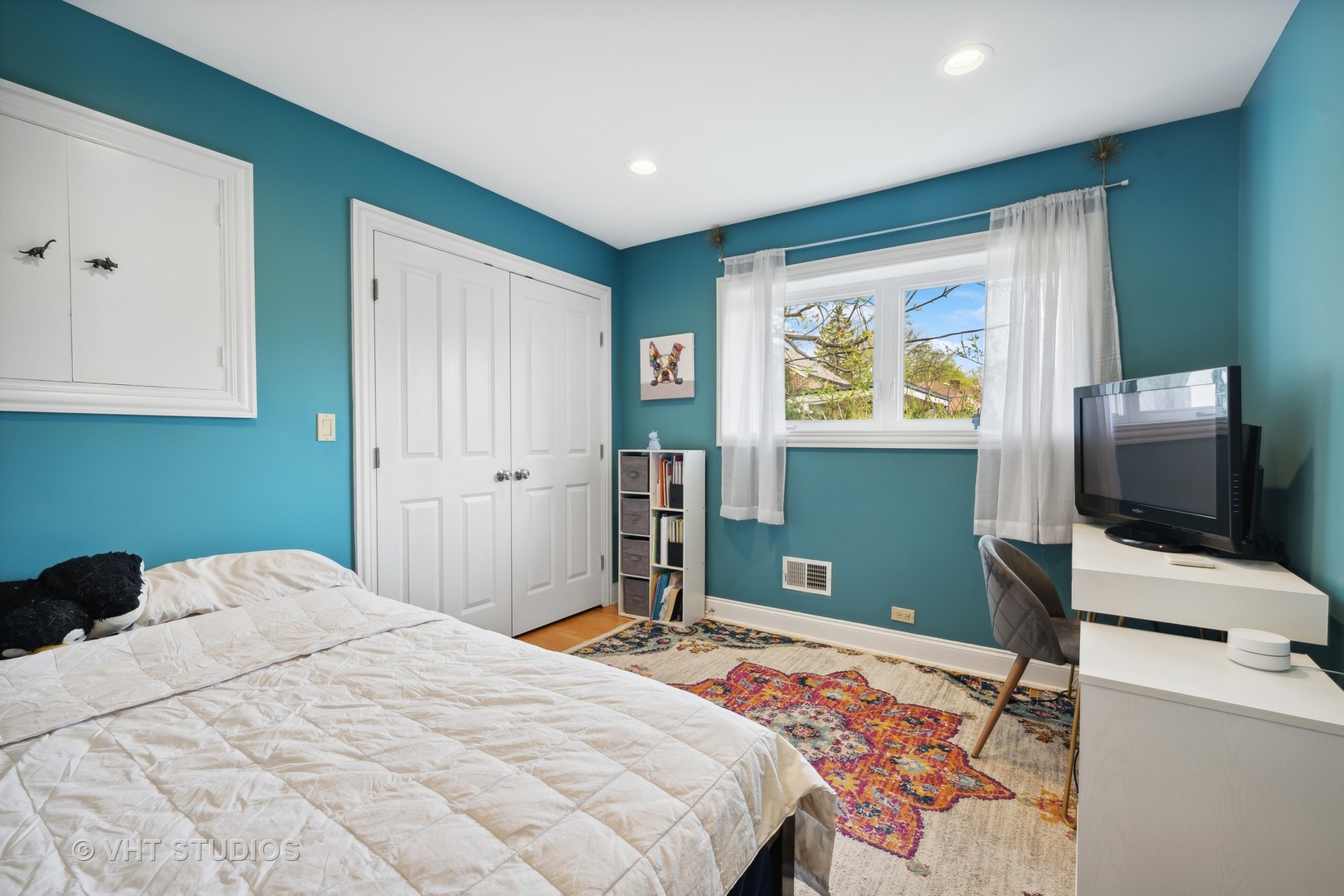 572 Dundee Road Glencoe, IL 60022 - Photo 13 of 26 a bedroom with a bed and a flat screen tv