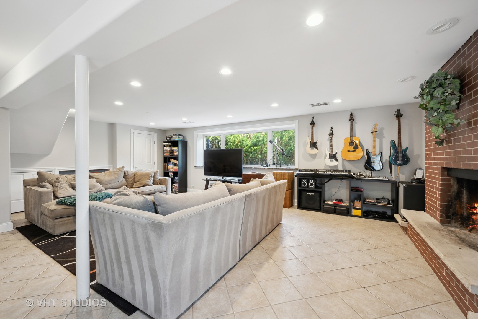 572 Dundee Road Glencoe, IL 60022 - Photo 15 of 26 a living room with furniture a fireplace and a potted plant