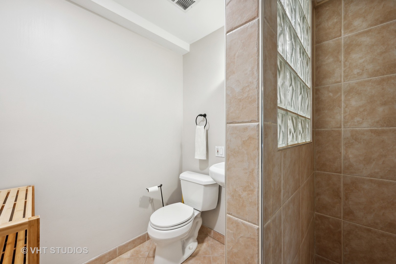 572 Dundee Road Glencoe, IL 60022 - Photo 17 of 26 a bathroom with a toilet and a shower