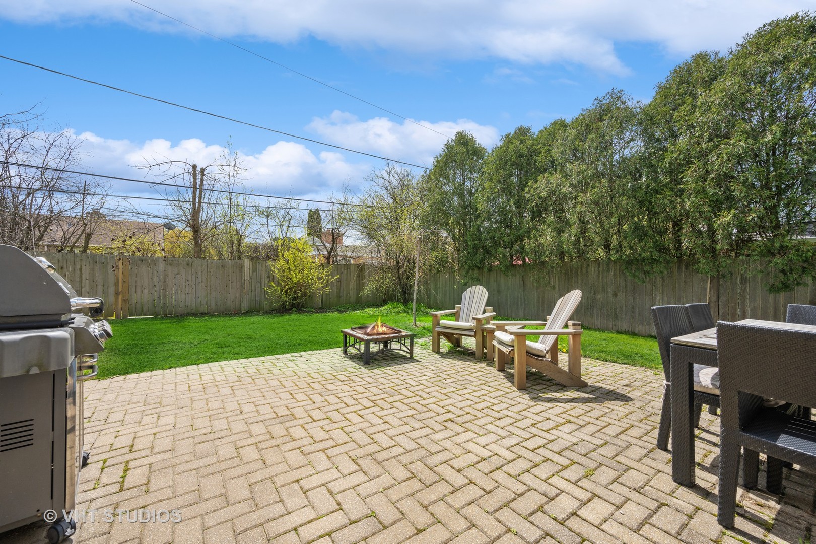 572 Dundee Road Glencoe, IL 60022 - Photo 20 of 26 a view of a patio with lawn chairs next to a yard
