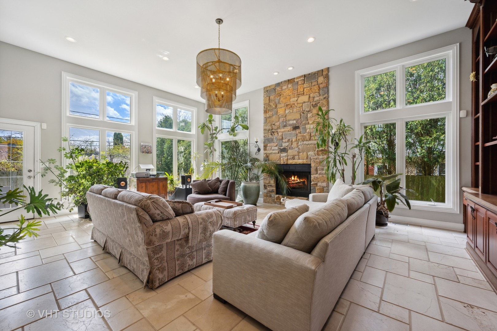 572 Dundee Road Glencoe, IL 60022 - Photo 2 of 26 a living room with furniture a large window and a fireplace