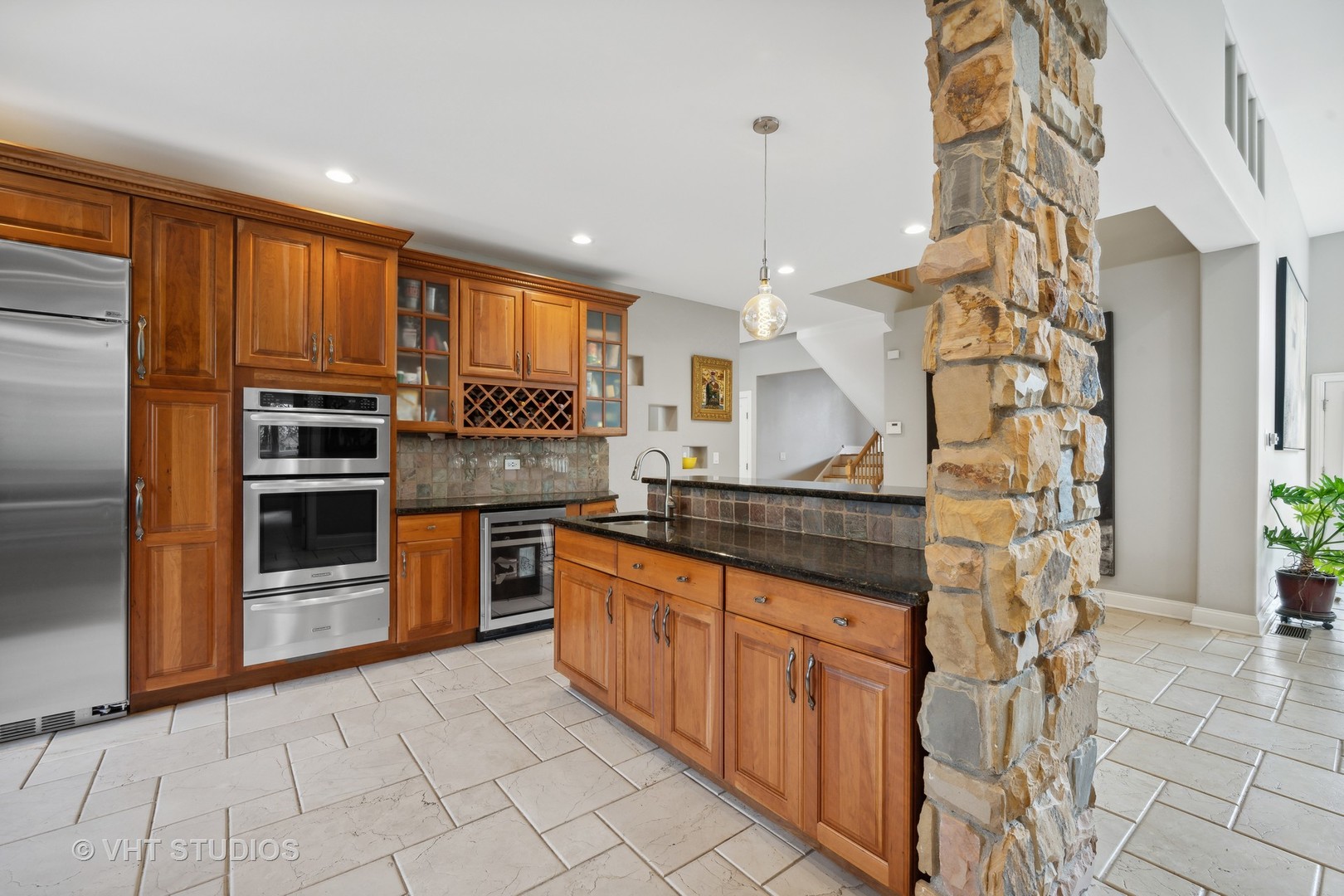 572 Dundee Road Glencoe, IL 60022 - Photo 5 of 26 a kitchen with stainless steel appliances granite countertop a stove and a refrigerator