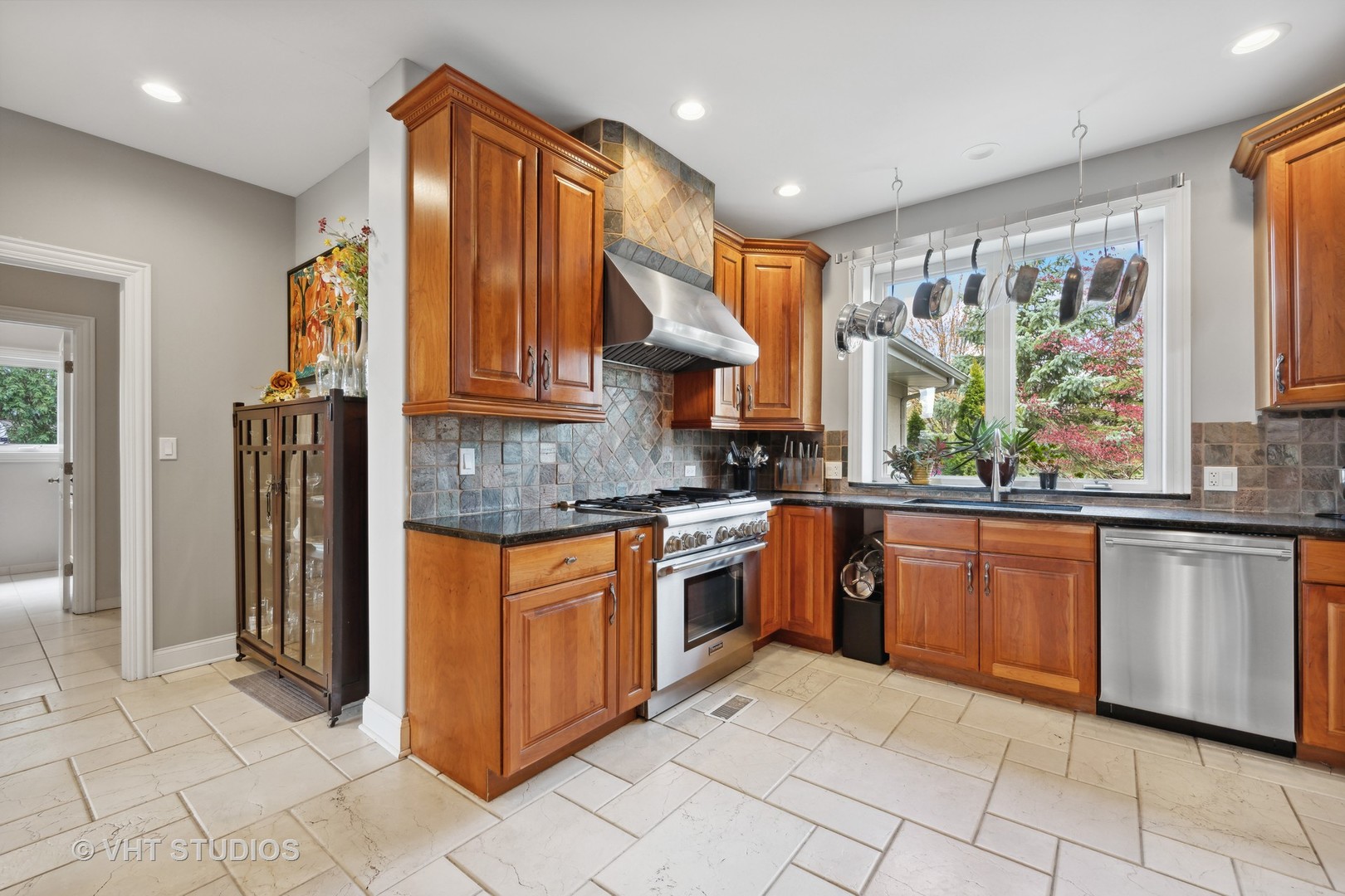 572 Dundee Road Glencoe, IL 60022 - Photo 6 of 26 a kitchen with stainless steel appliances granite countertop a stove a sink and a refrigerator