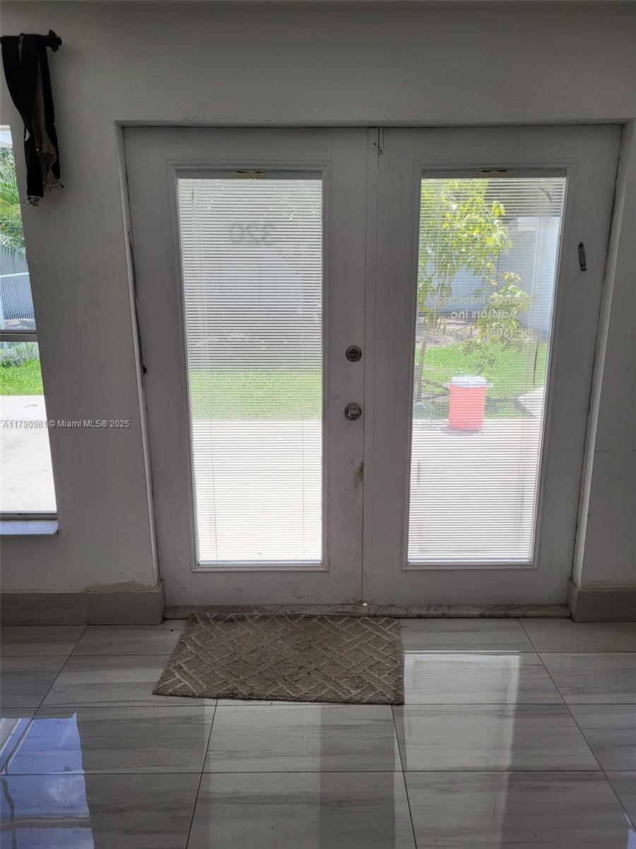 1650 Northeast 147th Street Miami, FL 33181 - Photo 17 of 56 FAMILY ROOM BACK DOORS