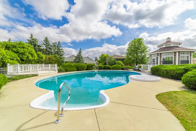 a view of a swimming pool with a garden