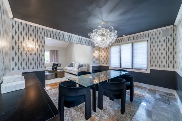 a kitchen with stainless steel appliances granite countertop a sink refrigerator and cabinets