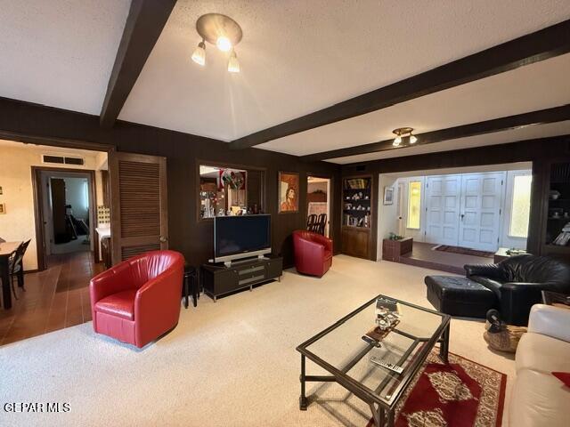 6435 Belton Road El Paso, TX 79912 - Photo 17 of 56 a living room with furniture a flat screen tv and a large window