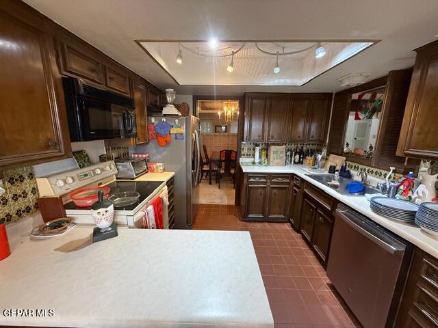 6435 Belton Road El Paso, TX 79912 - Photo 20 of 56 a kitchen filled with stainless steel appliances kitchen island granite countertop a sink dishwasher stove and cabinets