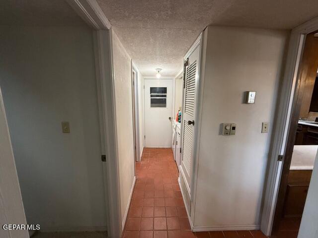 6435 Belton Road El Paso, TX 79912 - Photo 31 of 56 a view of a hallway with wooden floor and a living room