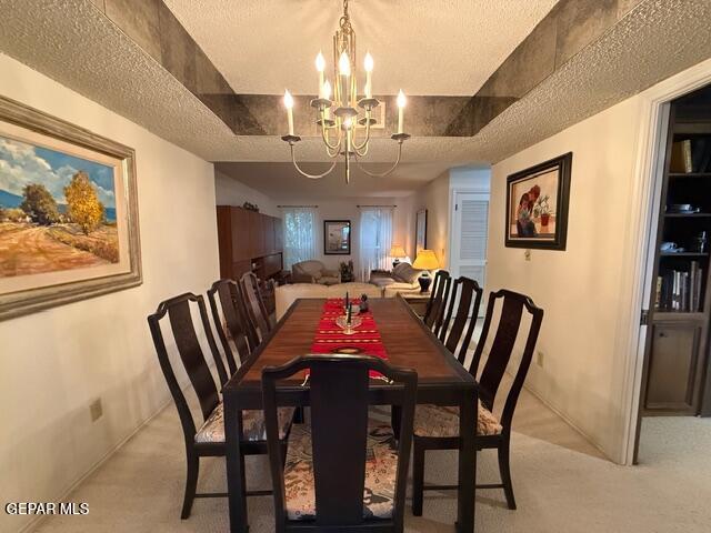6435 Belton Road El Paso, TX 79912 - Photo 33 of 56 a view of a dining room with furniture and chandelier