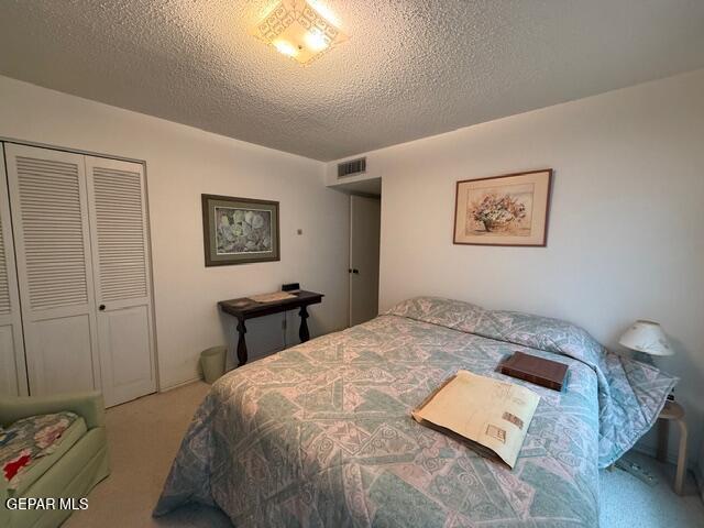 6435 Belton Road El Paso, TX 79912 - Photo 42 of 56 a bedroom with a bed and a painting on the wall
