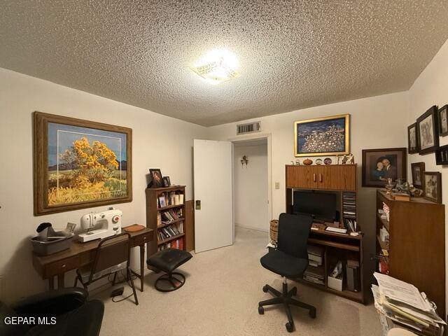 6435 Belton Road El Paso, TX 79912 - Photo 44 of 56 a view of a workspace with furniture and gym equipment