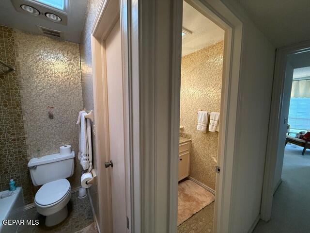 6435 Belton Road El Paso, TX 79912 - Photo 45 of 56 a bathroom with a granite countertop toilet and a shower