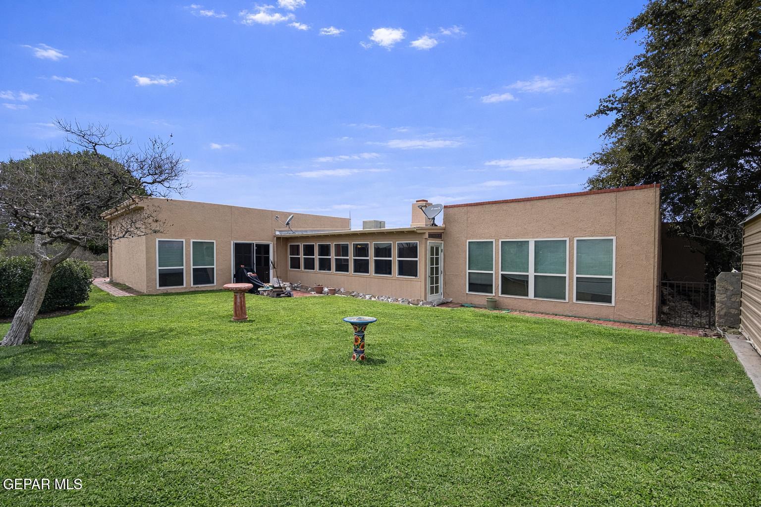 6435 Belton Road El Paso, TX 79912 - Photo 6 of 56 a view of a house with a backyard
